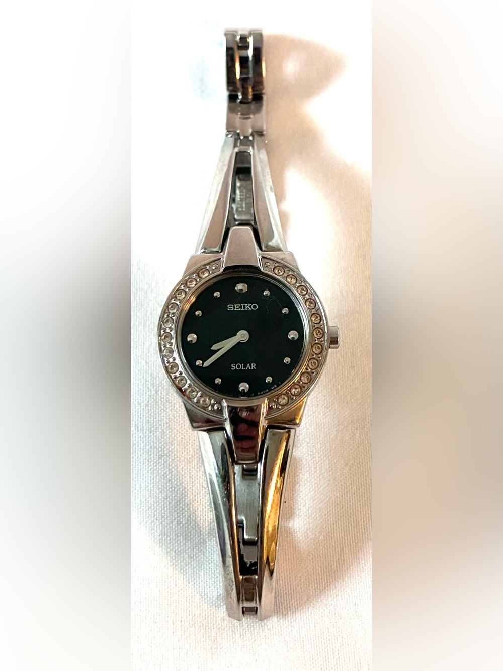 Women’s silver-tone stainless steel Seiko Solar watch, crystal-accented bezel